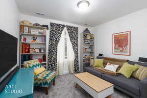 Living room featuring carpet floors