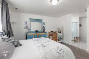 Bedroom with carpet flooring and baseboards
