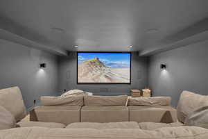 Home theater room with recessed lighting and baseboards