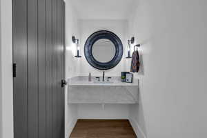 Bathroom with vanity and light wood finished floors
