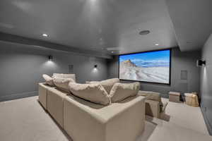 Cinema featuring light carpet and recessed lighting