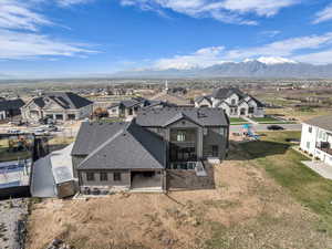 Aerial view of residential area featuring a mountain backdrop