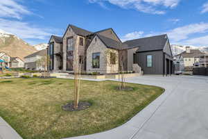 French provincial home with a mountain view, board and batten siding, and a residential view
