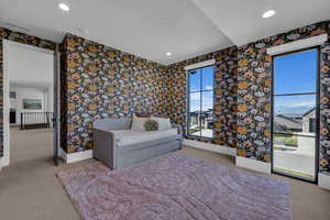 Bedroom featuring light carpet, access to exterior, wallpapered walls, and recessed lighting