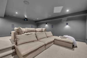 Carpeted cinema featuring recessed lighting and baseboards