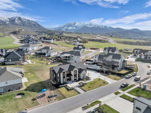 Aerial perspective of suburban area with a mountainous background