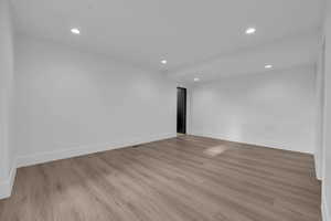 Unfurnished room featuring recessed lighting and light wood-style flooring