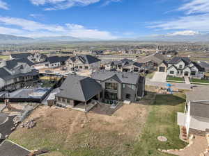 Aerial perspective of suburban area featuring a mountain backdrop
