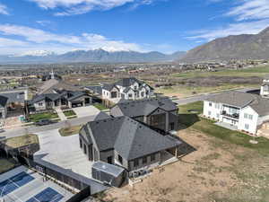 Aerial perspective of suburban area featuring a mountainous background