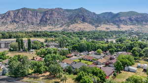 Aerial perspective of suburban area featuring a mountain backdrop
