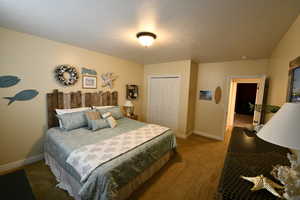 Bedroom featuring a closet and carpet flooring