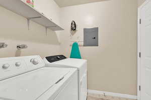 Laundry room featuring light floors, and separate washer and dryer