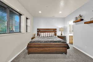 Bedroom with carpet, recessed lighting, and ensuite bath