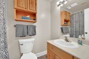 Full bathroom featuring a shower with curtain and vanity