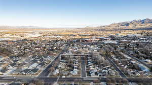 View of property location with mountains and nearby suburban area