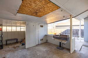 Miscellaneous room featuring unfinished concrete flooring