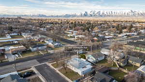 Aerial perspective of suburban area with a mountainous background