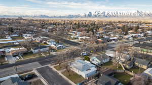 Aerial view of residential area featuring a mountainous background