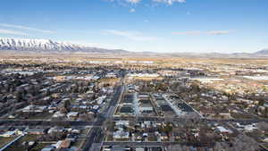 Aerial perspective of suburban area featuring a mountainous background