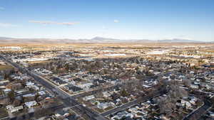 Aerial perspective of suburban area with a mountain backdrop