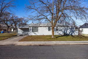 View of front of property with a front yard