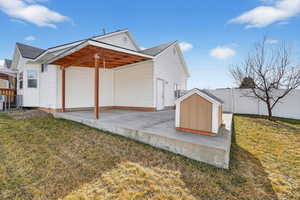 View of side of home featuring a patio area, a fenced backyard, and a gazebo
