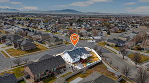 Aerial view of residential area featuring mountains