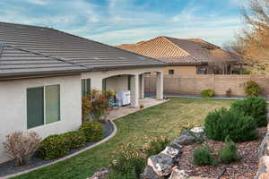 Fenced backyard with a patio area