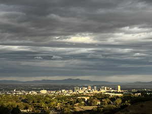 View of mountain backdrop featuring nearby urban area
