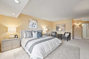 Bedroom featuring light carpet and recessed lighting