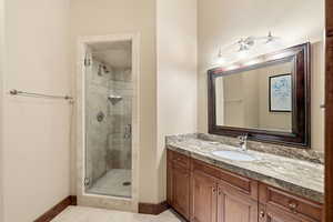 Bathroom with vanity and a stall shower