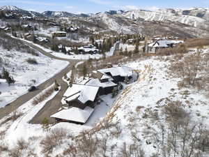 Snowy aerial view featuring a mountain view