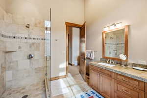 Bathroom with a stall shower and vanity