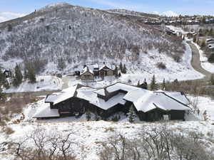 Snowy aerial view featuring a mountain view