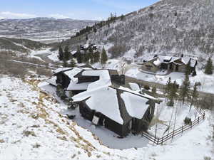 Snowy aerial view featuring a mountain view