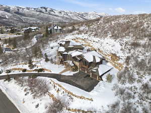 Snowy aerial view featuring a mountain view