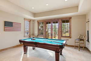 Playroom with plenty of natural light, french doors, pool table, light colored carpet, and recessed lighting