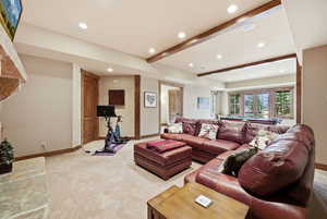Carpeted living area featuring beamed ceiling, recessed lighting, and billiards table