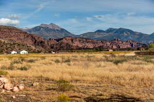 View of mountain backdrop with rural landscape