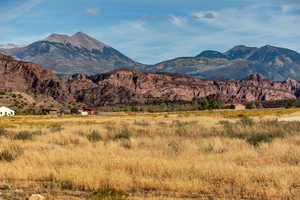 View of mountain backdrop featuring rural landscape