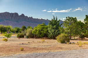 View of mountain background featuring rural landscape