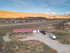 Aerial view of residential area featuring a mountainous background