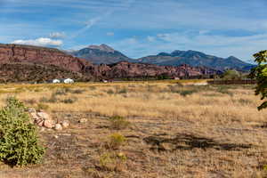 View of mountain background featuring rural landscape