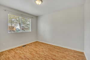 Unfurnished room featuring light wood finished floors