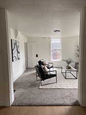 Living room with light wood-style flooring and baseboards