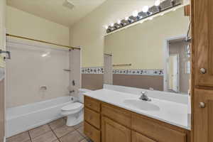 Bathroom with  shower combination, vanity, and light tile patterned floors