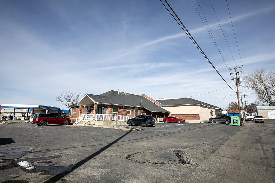 View of front of property featuring uncovered parking