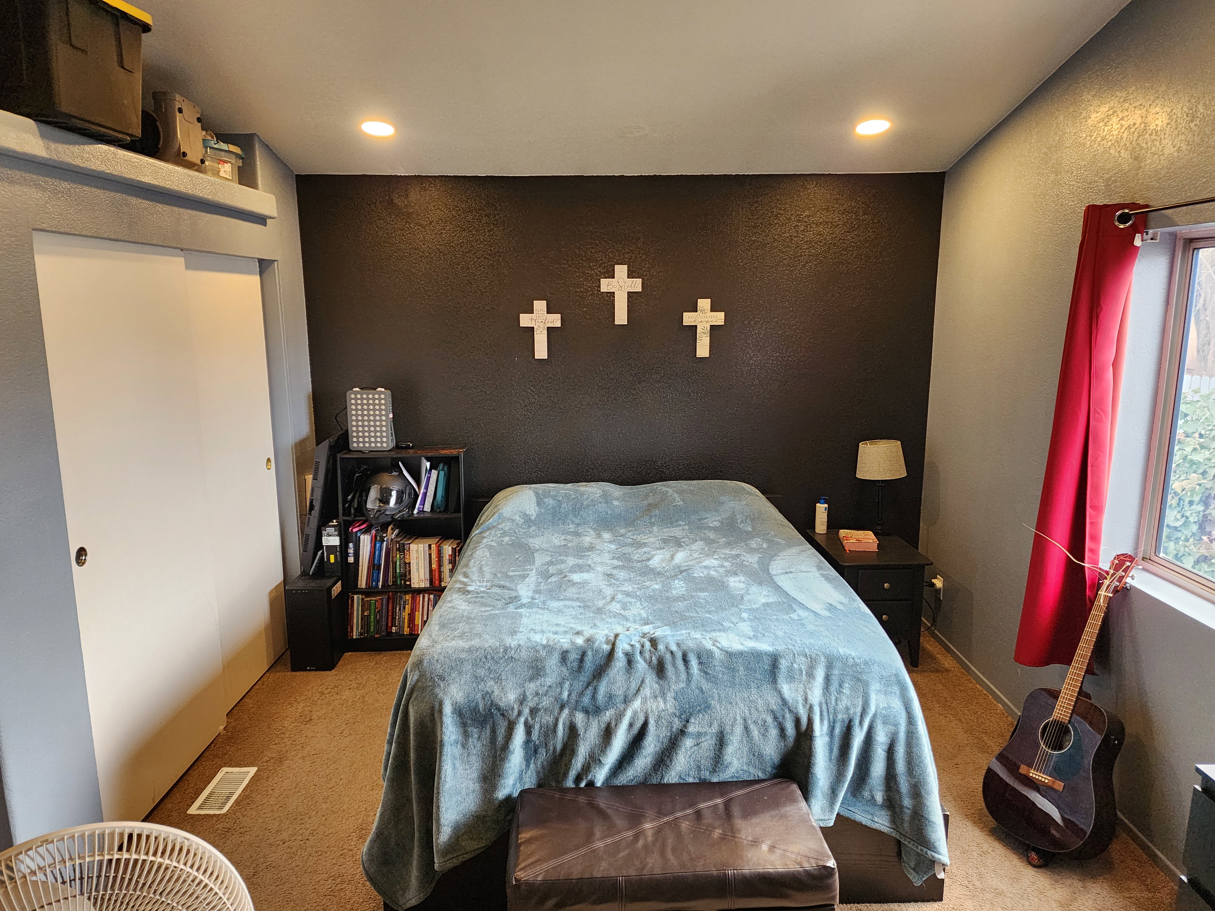 Bedroom featuring carpet flooring, an accent wall, and recessed lighting