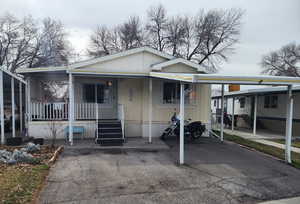 View of front of property featuring covered porch