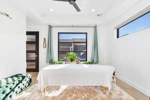 Bedroom featuring light wood-style floors, ceiling fan, and recessed lighting